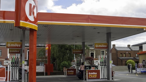 A woman fueling her car at Circle K